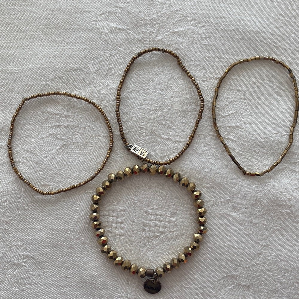 Set of 4 gold toned beaded stretch bead bracelets Larger one is Erimish